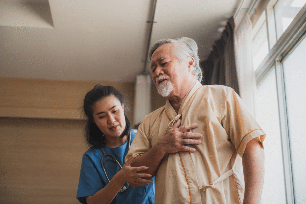doctor helps patient in pain walk around the ER